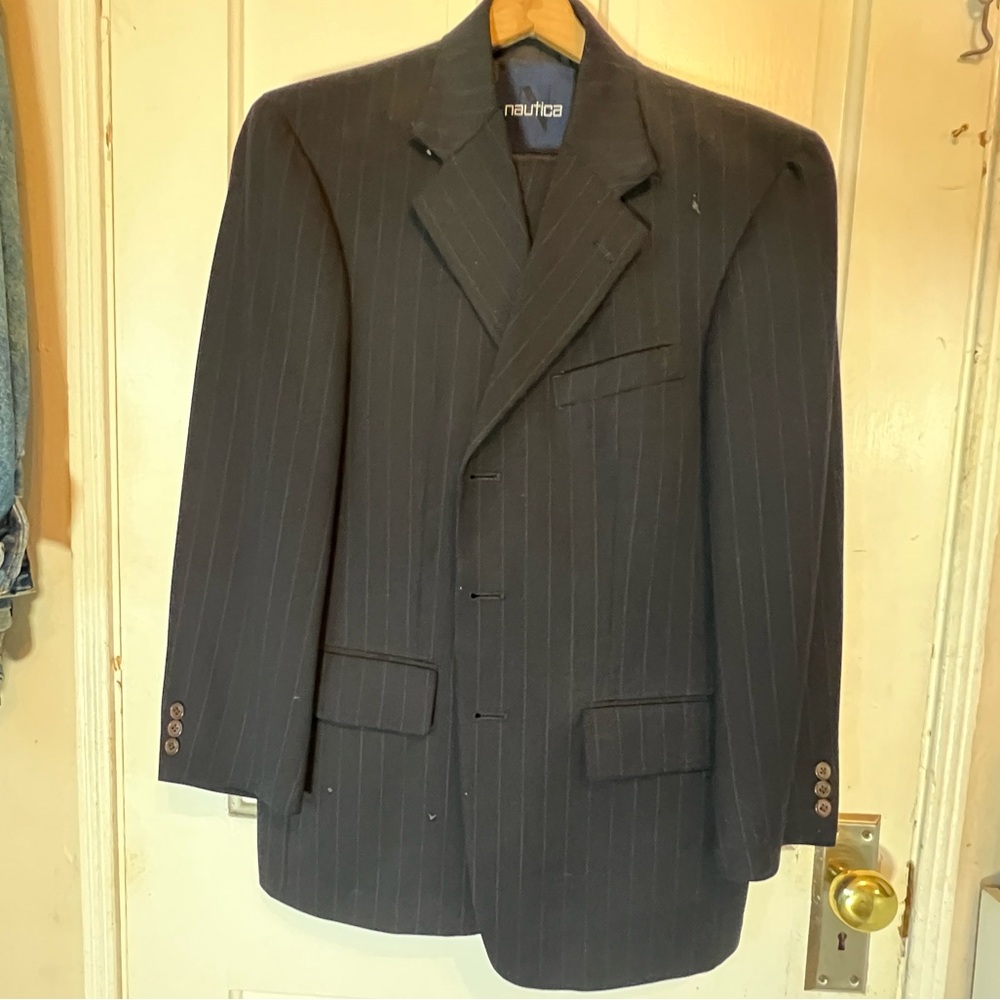 This is a classy Nautica mens suit in good condition.